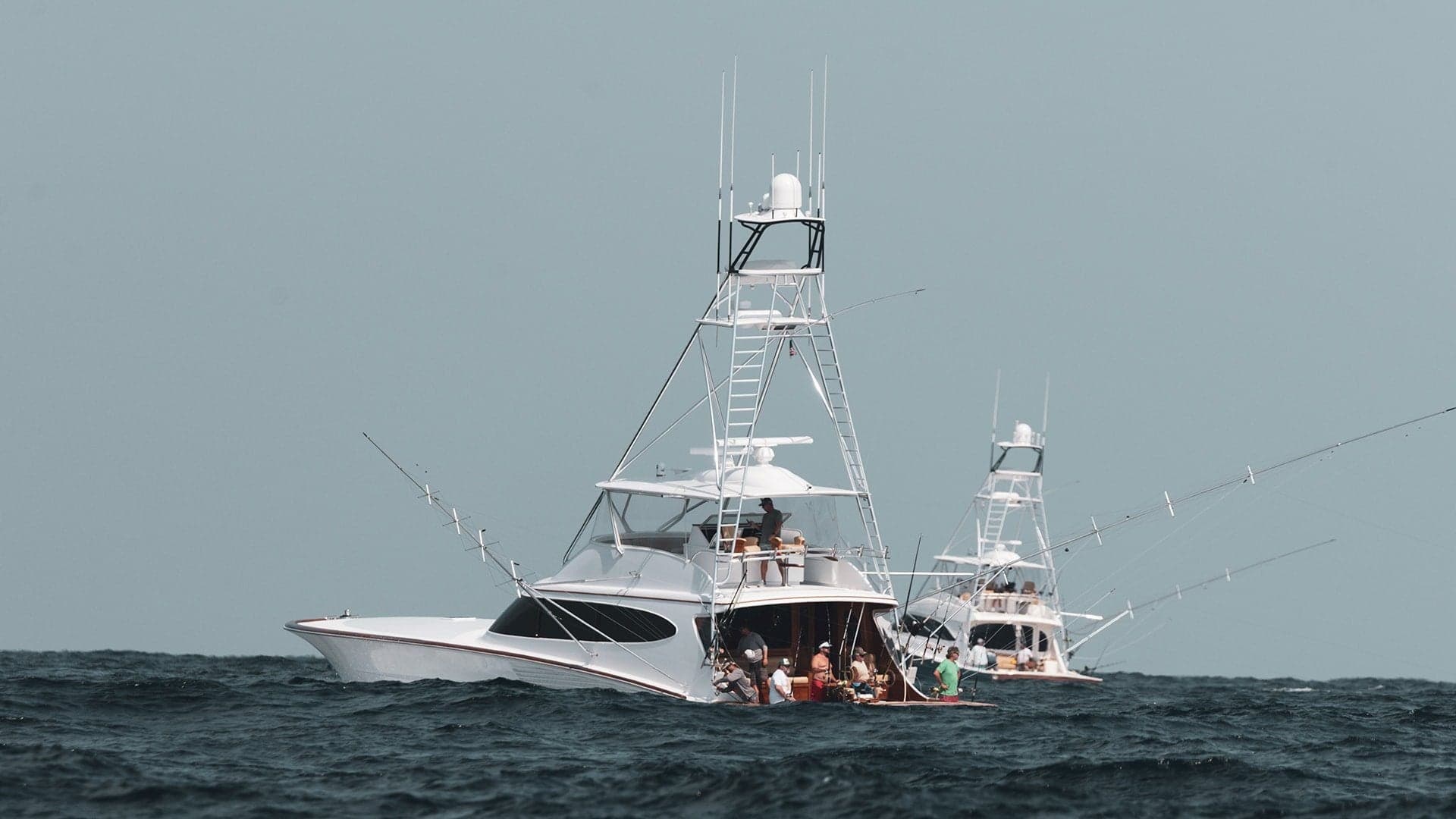 Two Bayliss sportfish convertibles trolling side by side with outriggers deployed at the White Marlin Open