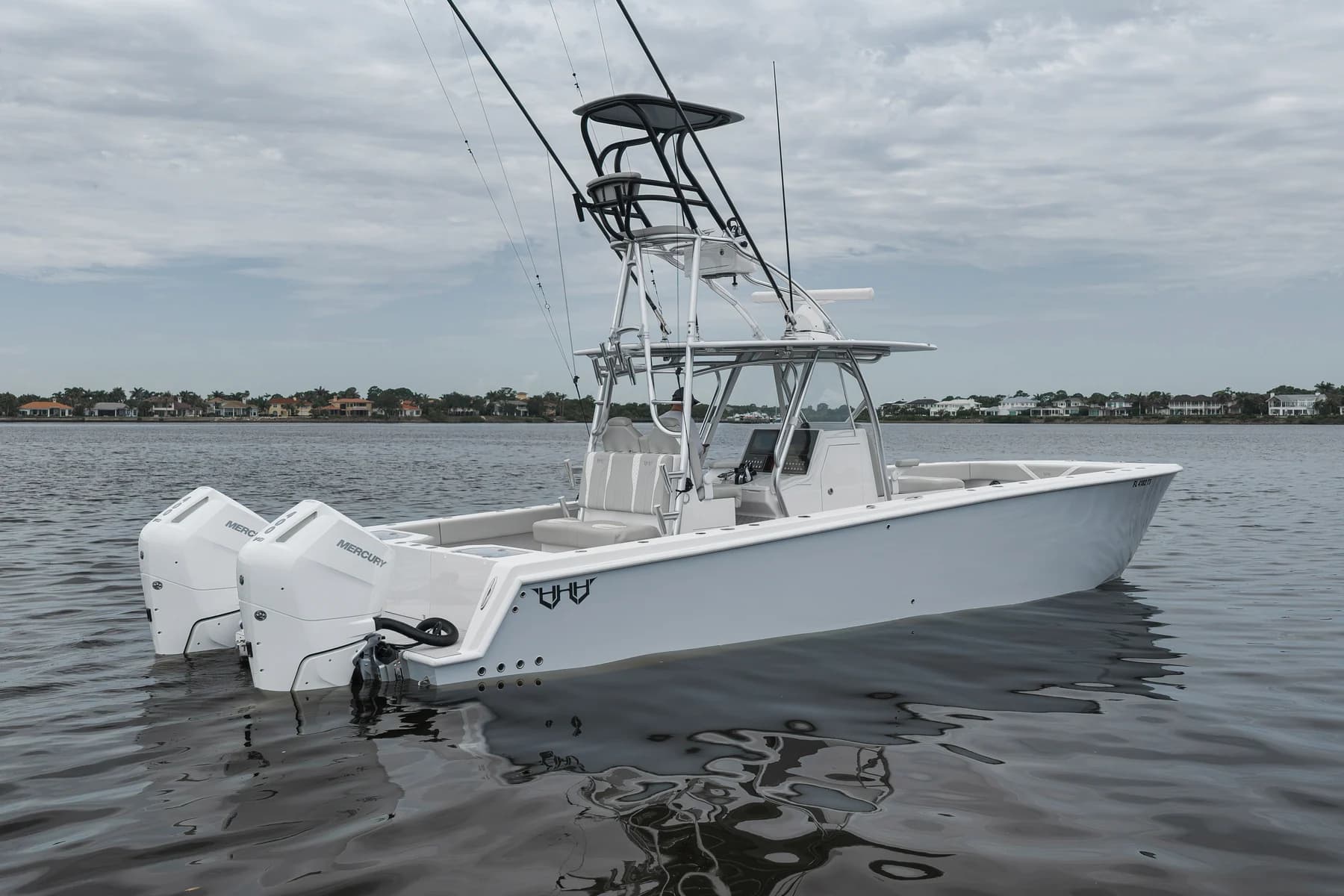 White center console with outboard engines photographed in Stuart, Florida