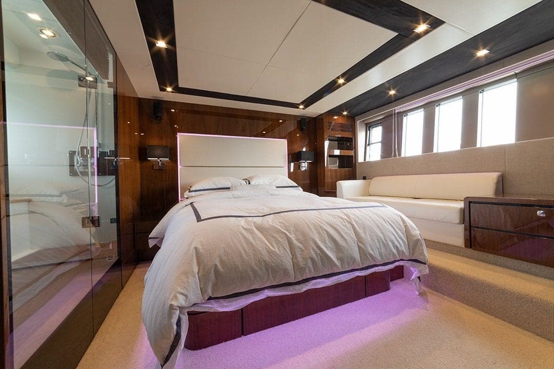 Standard yacht photography showing blown-out windows, dark shadows, and lost interior detail from single raw exposure without professional lighting control