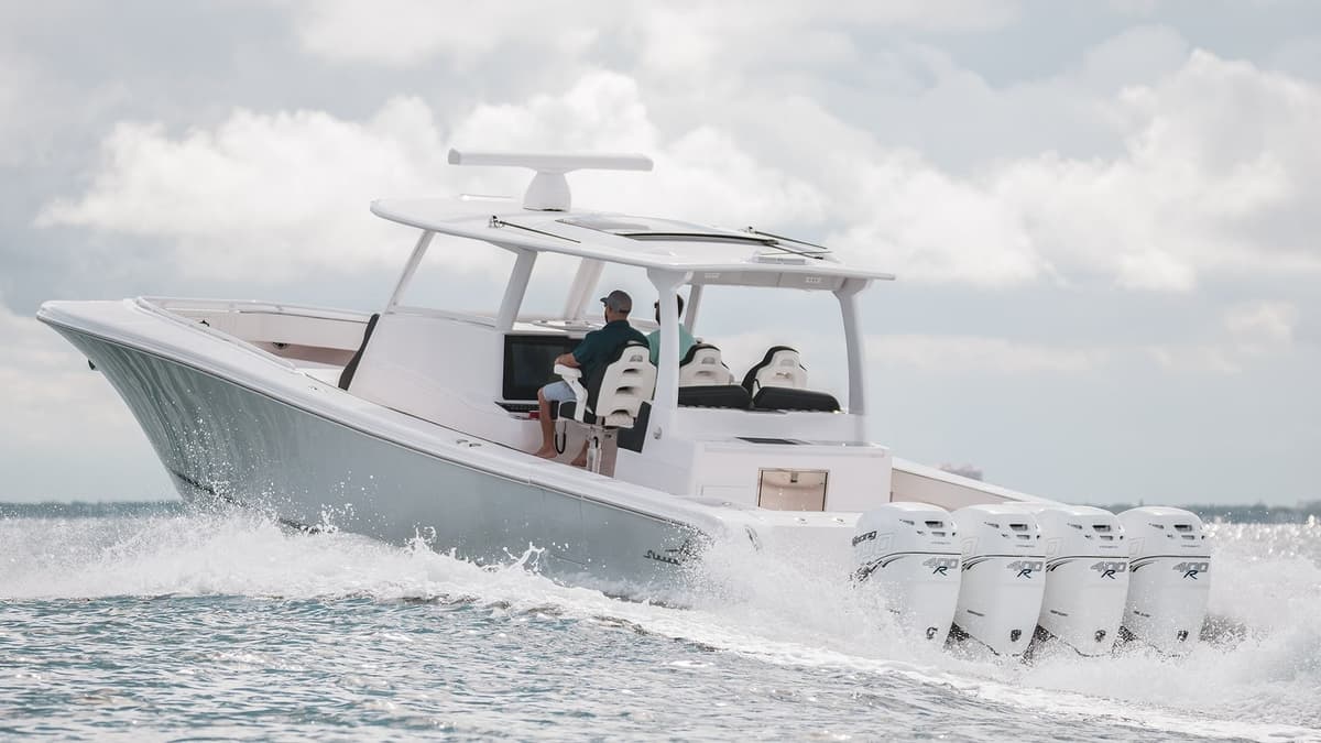 High-performance sportfishing boat with four powerful engines cruising through open water