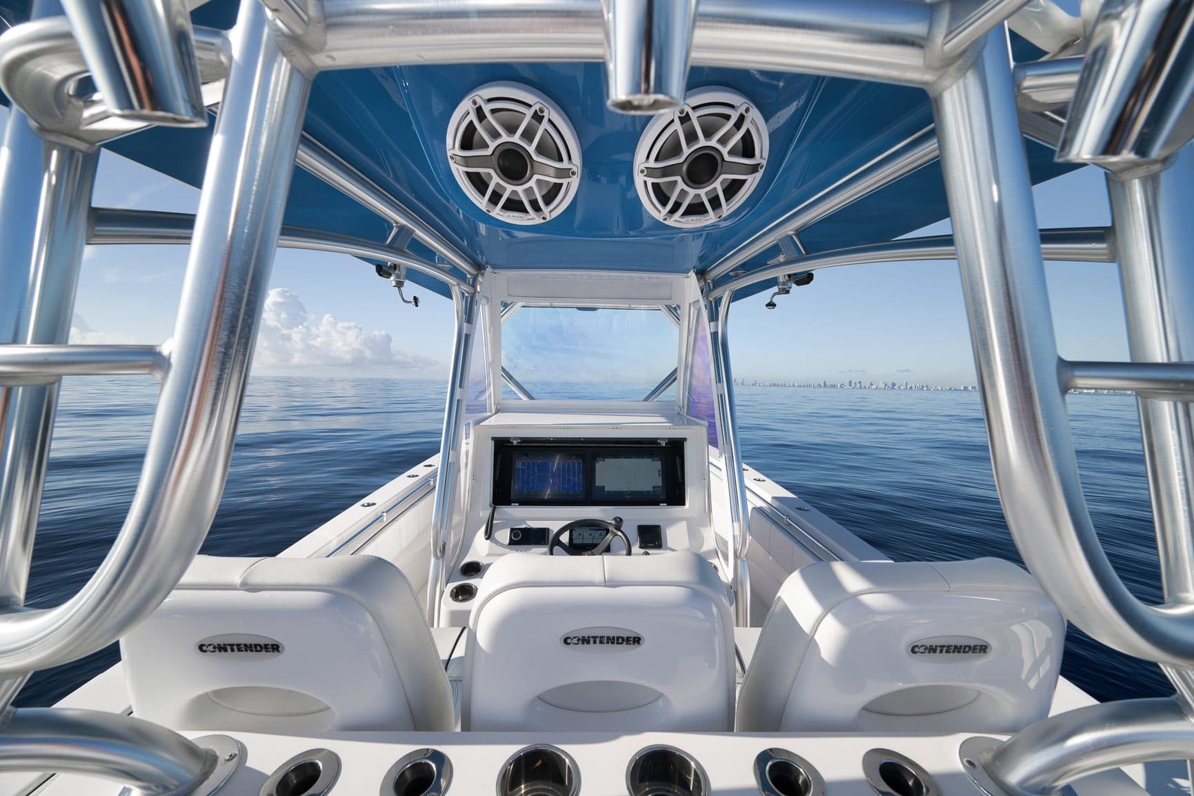Center console helm and seating under the hardtop, open water
