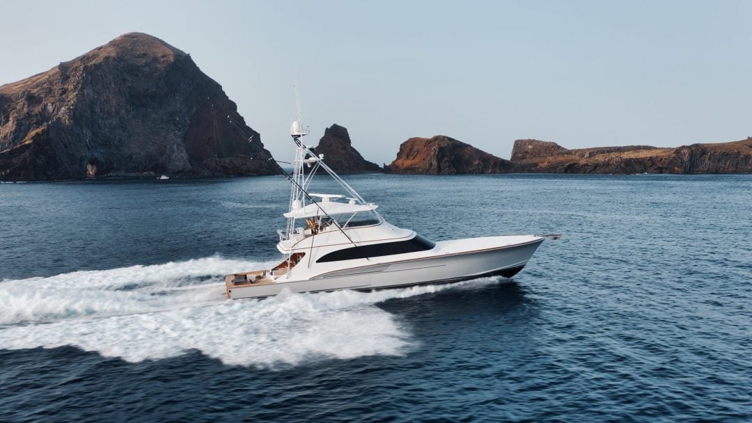 Professional yacht photography of Jaruco Jarret Bay sportfishing boat cruising through rocky islands in South Florida
