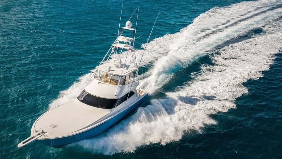 Aerial drone photo of a yacht in turquoise water by AH360 Photography