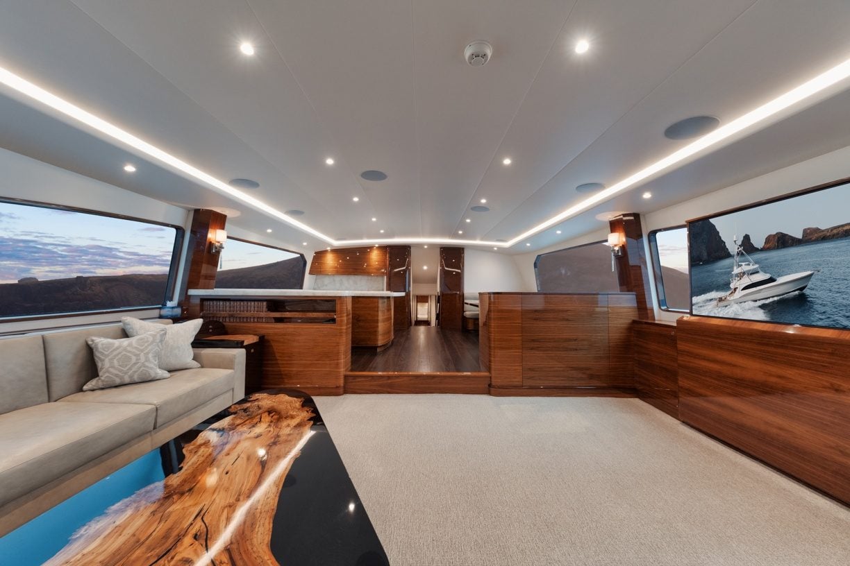 Jarrett Bay Jaruco sportfishing yacht interior showing salon seating and wood craftsmanship