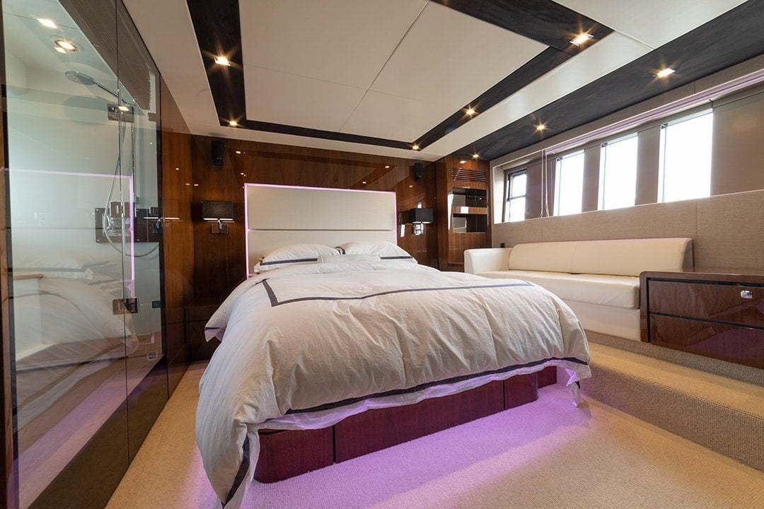 Standard yacht photography showing blown-out windows, dark shadows, and lost interior detail from single raw exposure without professional lighting control