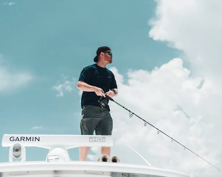 Custom Rod and Reel Angler Fishing On Roof Of Boat
